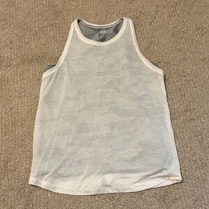 Athletic girl white tank top with gray camo second layer tank top underneath